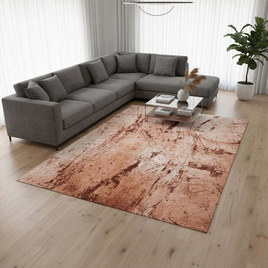 Orange Brown And White Abstract Washable Area Rug With UV Protection Area Rug | 9' x 13' in modern living space with gray sofa.