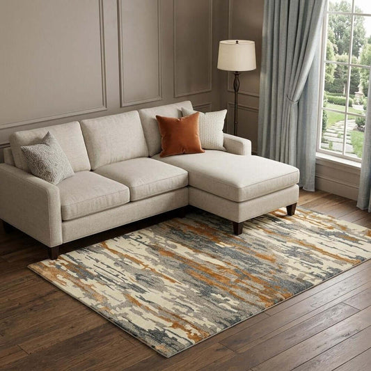 Orange Ivory And Green Wool Abstract Hand Tufted Area Rug | 9' x 13' placed in a cozy living room with a sectional sofa.