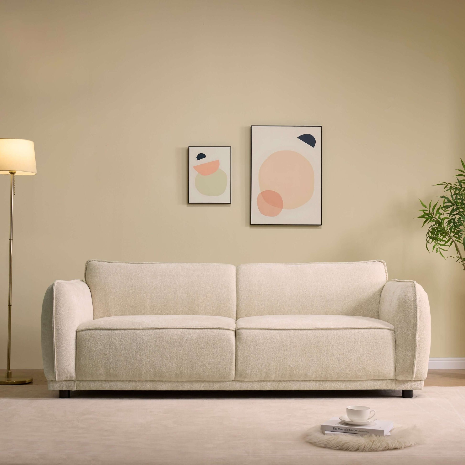Oslo Boucle Sofa – 84” Round Arm Modern 3-Seater Couch (Beige Upholstered) in a stylish living room setting.
