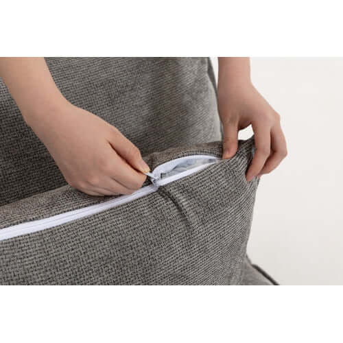 Hands unzipping the cushion cover of the deep seat velvet Oversized Cloud Couch Modular Loveseat 74.8".