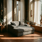Oversized Gray Lounge Chair Corduroy with Cup Holder & 2 Pillows in a sunlit living room.