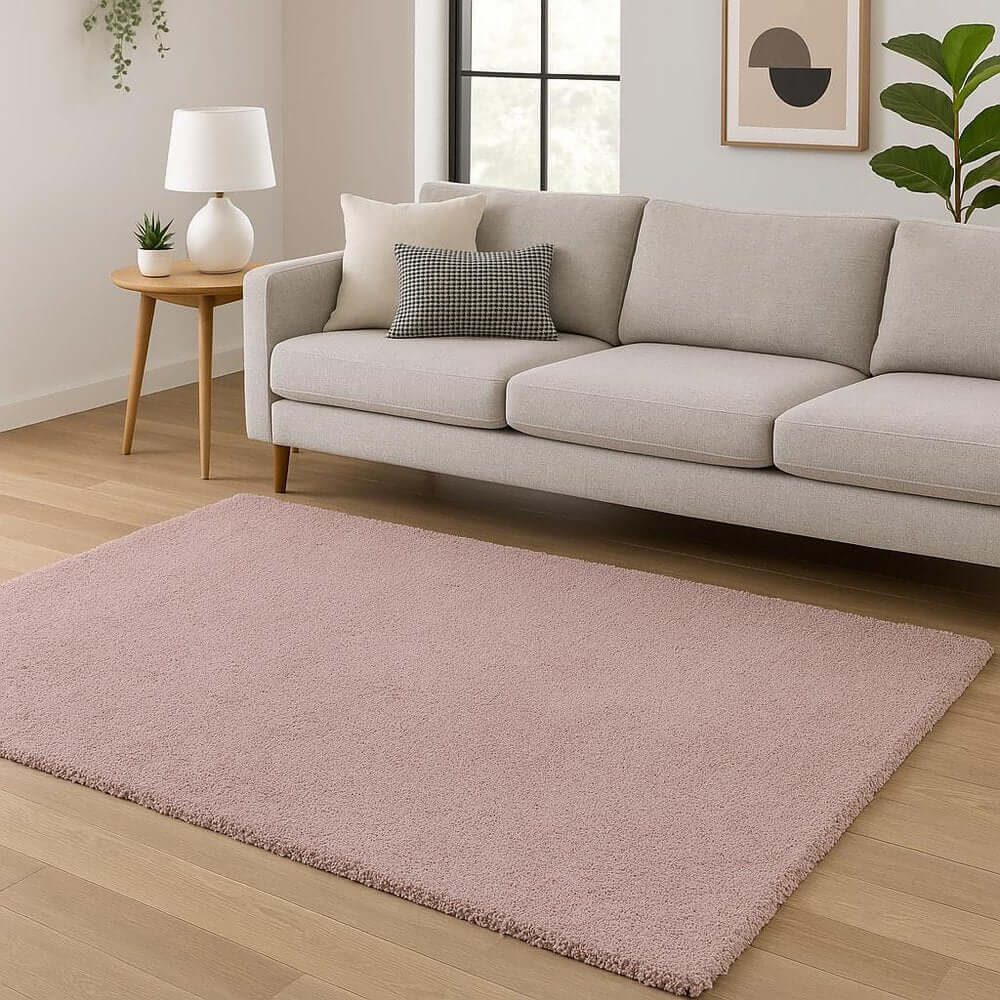 Pink Shag Hand Woven Area Rug | 9' x 13' placed under a light gray sofa in a cozy living room setting.