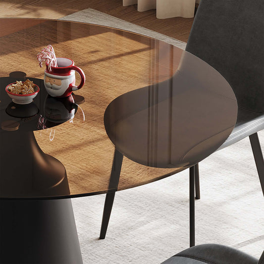 Round Mid-Century Modern Dining Table with Glass Top 35" displaying a black glass surface and decorative items.