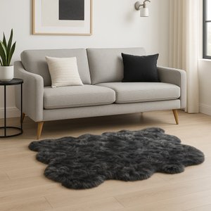Scalloped faux fur shag rug in stylish living room with gray couch and decorative pillows.