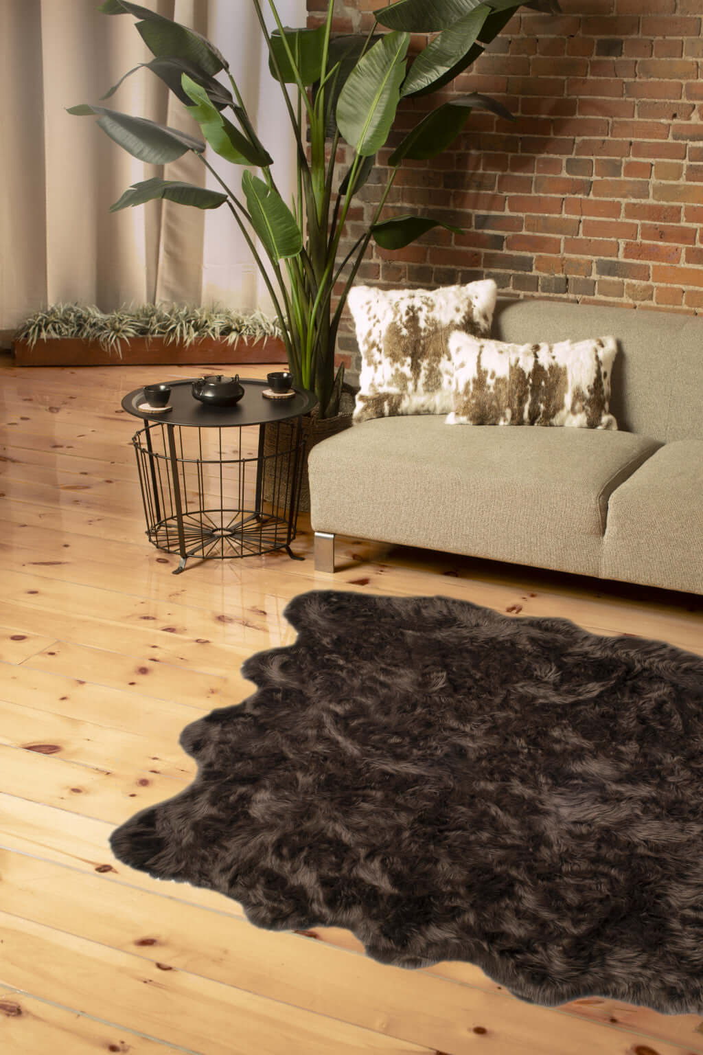 Scalloped faux fur shag rug in a modern living room setting, showcasing cozy elegance and stylish decor.