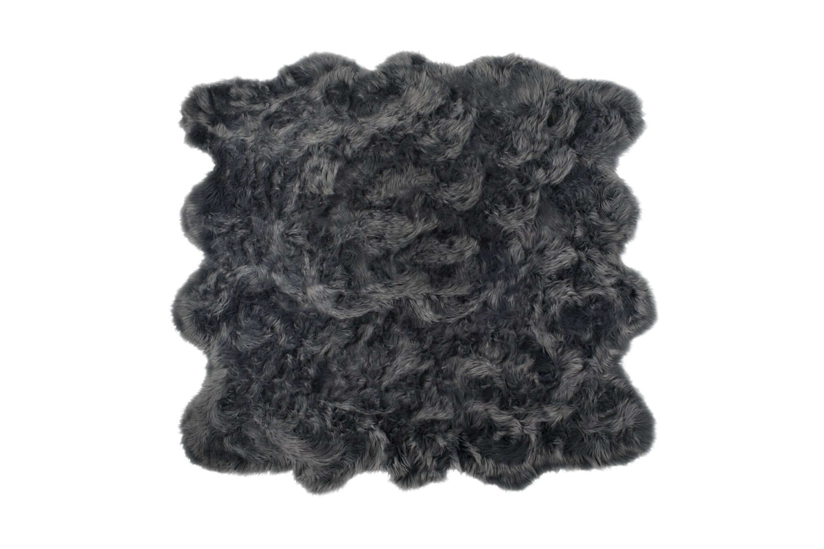 Scalloped faux fur square area shag rug in charcoal, soft and stylish addition to modern decor.