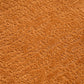 Close-up of soft, textured orange fabric upholstery of the Curved Compression Foam Sectional Sofa – 110” Modular Chenille Couch (Sleeper Style).