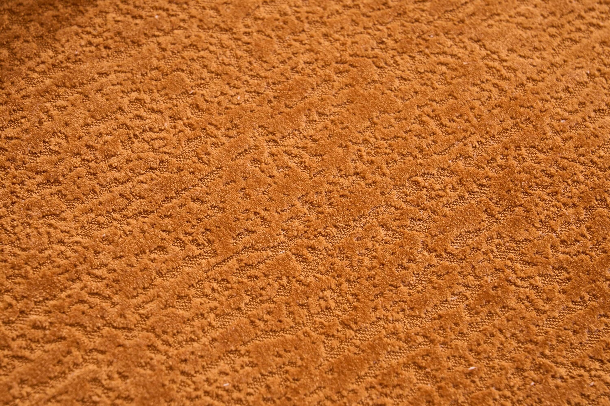Close-up of soft, textured orange fabric upholstery of the Curved Compression Foam Sectional Sofa – 110” Modular Chenille Couch (Sleeper Style).