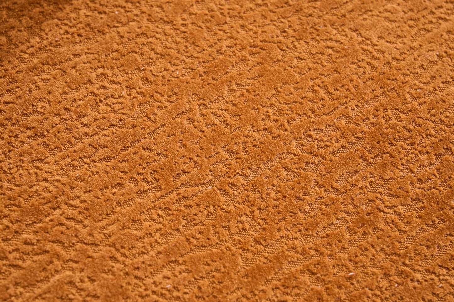 Close-up of soft, textured orange fabric upholstery of the Curved Compression Foam Sectional Sofa – 110” Modular Chenille Couch (Sleeper Style).