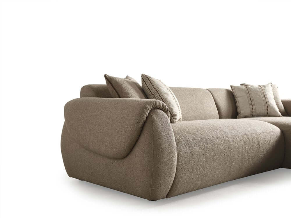 Taupe Boucle L Shaped Two Piece Sofa and Chaise Sectional With Toss Pillows featured in a cozy living room setting.