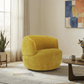 Thornton Chenille Swivel Chair – Barrel Swivel Accent Chair (Gold or Sand) in cozy living room setting.