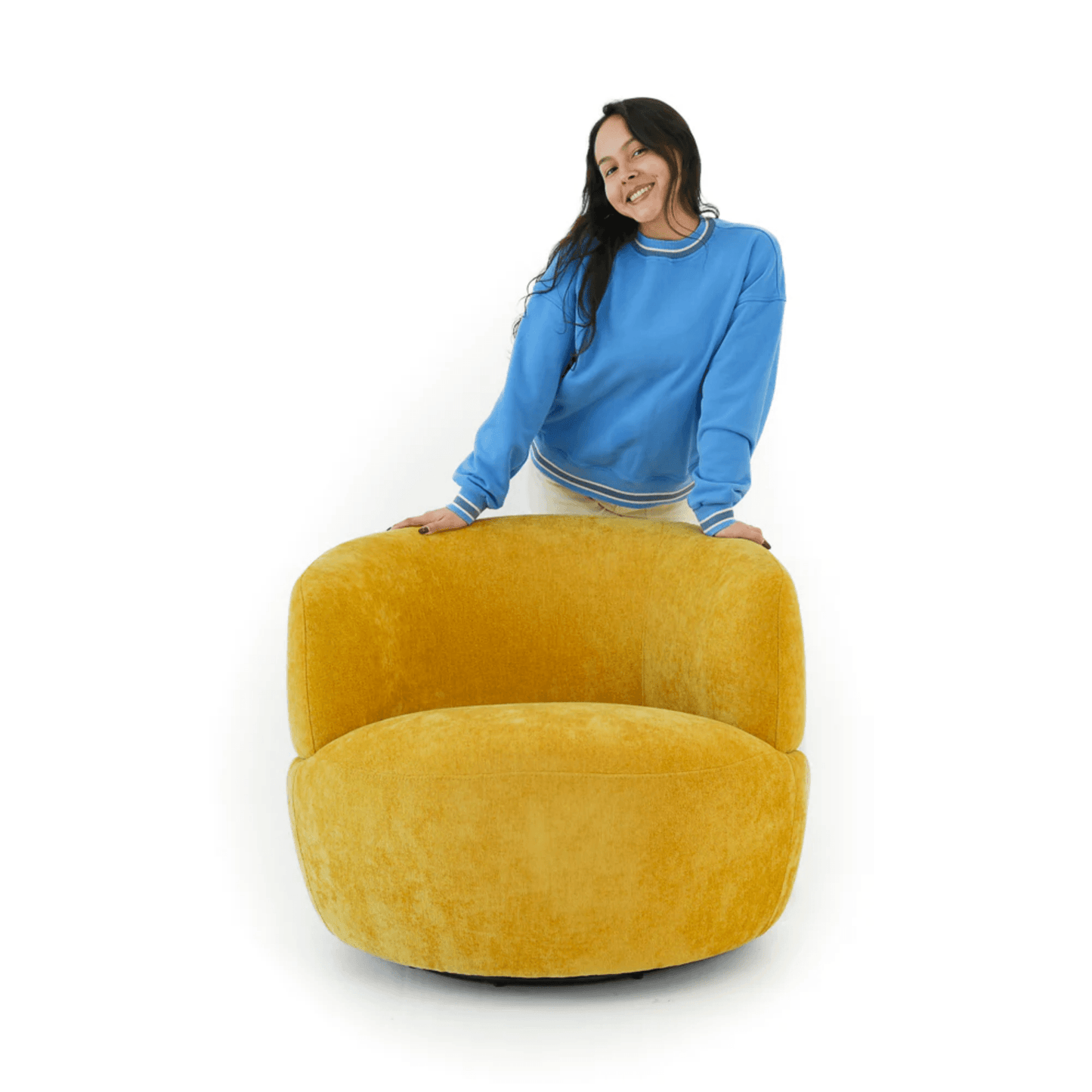 Thornton Chenille Swivel Chair – Barrel Swivel Accent Chair (Gold or Sand) in a cozy setting with a model.