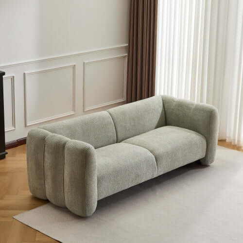 Tonson Boucle Sofa – 83” Curved Wave 3-Seater Sofa (3 Colors, Modern Sculptural Design) in a modern living room.
