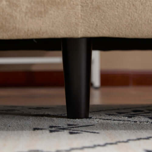 Tonson Boucle Sofa – 83” Curved Wave 3-Seater Sofa (3 Colors, Modern Sculptural Design) leg detail on a patterned rug.