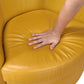 Hand pressing the plush seat of the Top-Grain Leather Barrel Swivel Chair – Modern Luxury 360° Accent Chair (3 Colors).