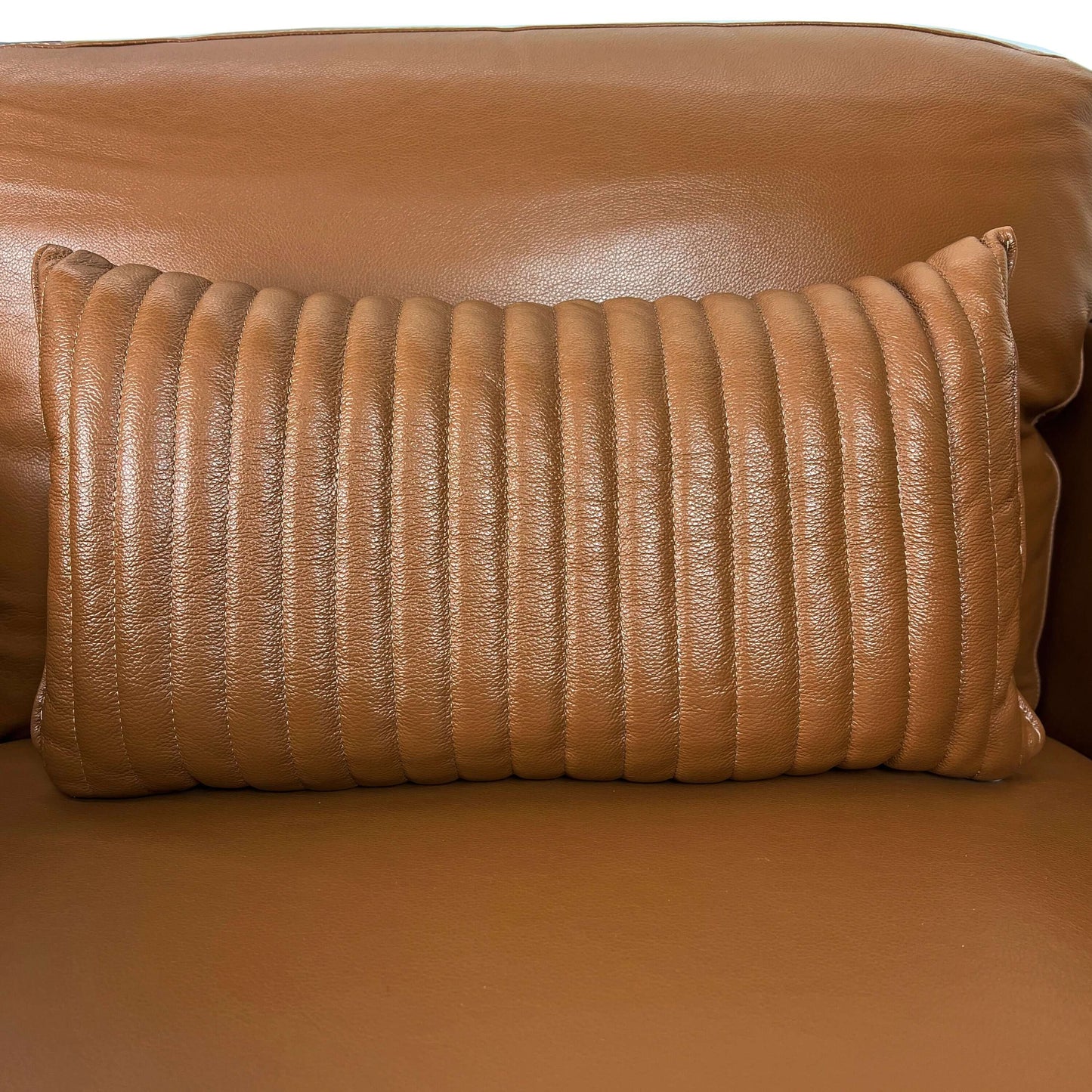 Tussio Saddle Tan Leather Chair – Italian Modern Accent Chair with Pillow featuring a textured brown pillow