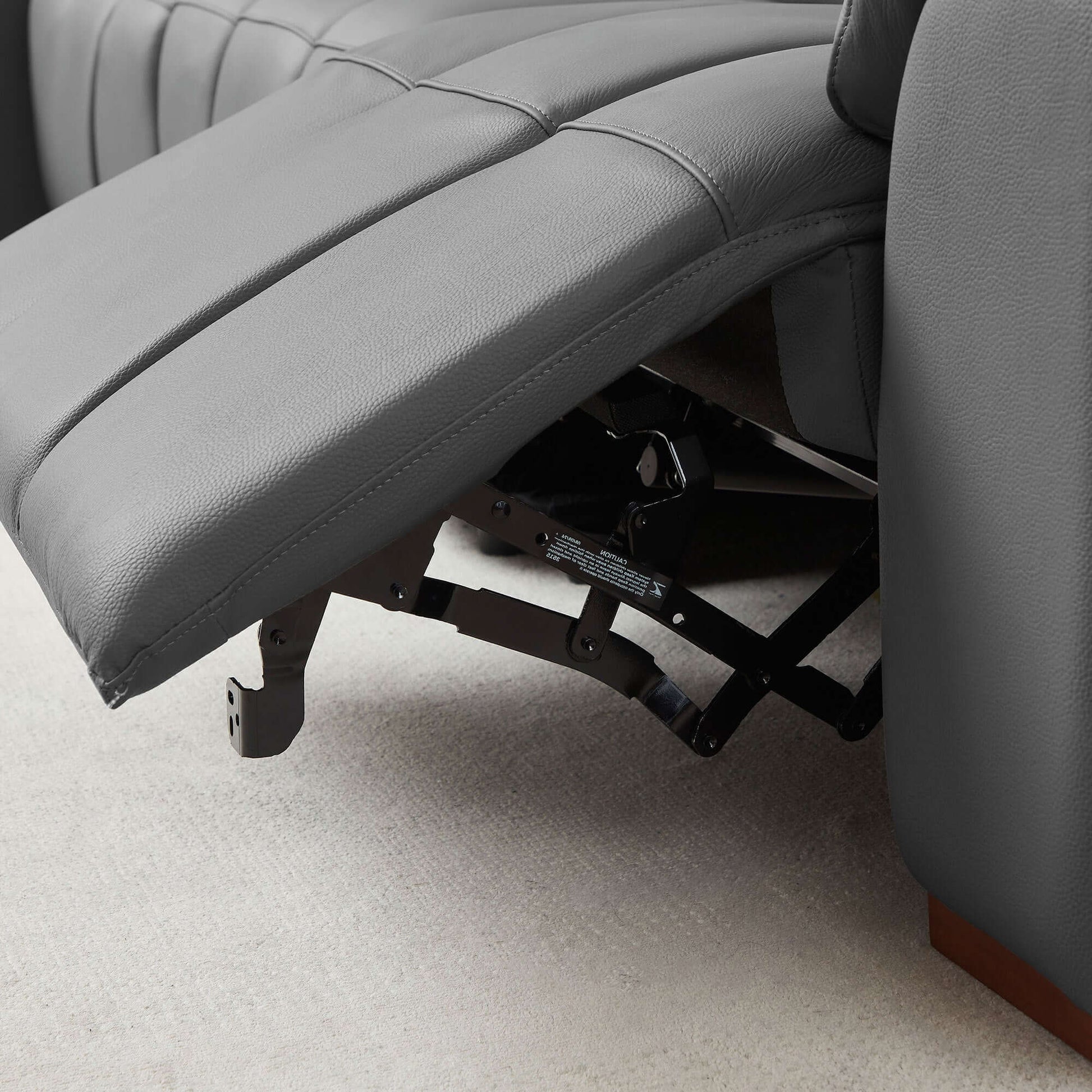 Close-up of the recliner mechanism in the Wall-Hugger Power Reclining Leather Sectional – 4 Seat L-Shape Recliner Sofa with USB (144'').