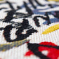 Close-up of a White Abstract Non Skid Area Rug | 9' x 13' showcasing colorful abstract patterns.