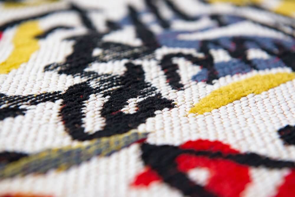 Close-up of a White Abstract Non Skid Area Rug | 9' x 13' showcasing colorful abstract patterns.