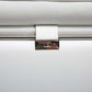 Close-up of the elegant metal detail on the White Italian Leather L Shaped Two Piece Sofa and Chaise Sectional.