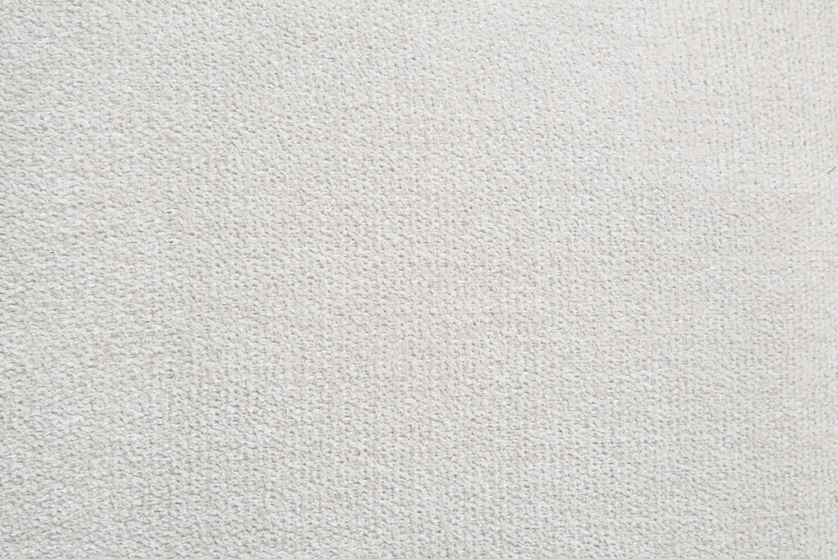 Textured white fabric upholstery suitable for a white sectional sofa.