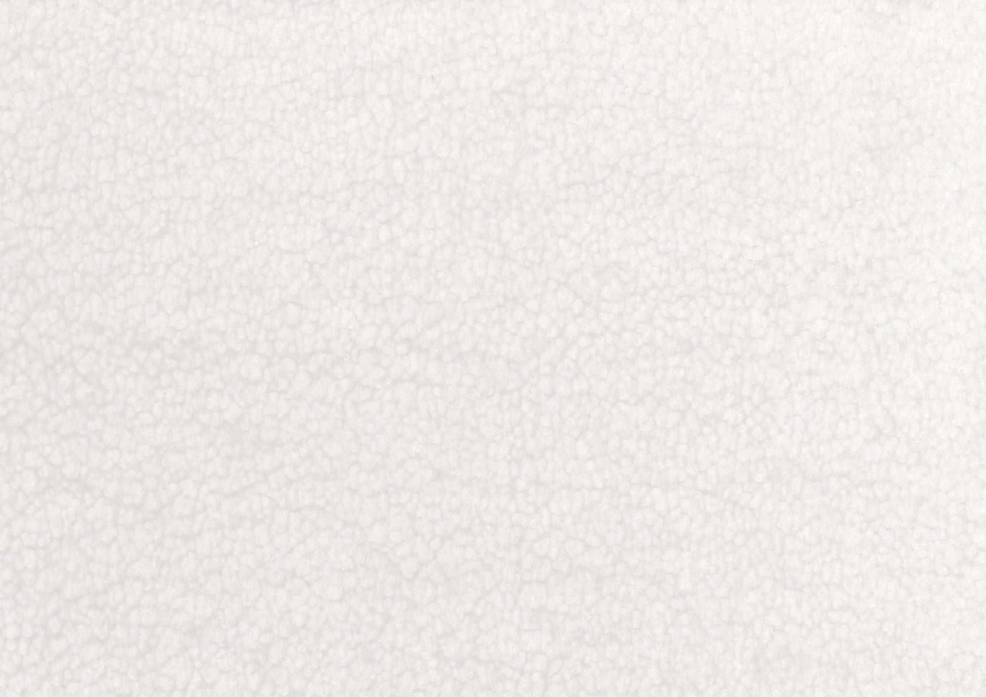 Close-up of white sherpa fabric texture, showcasing its soft and cozy appearance.