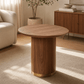 Willene Walnut Finish End Table featuring a round top and sleek pedestal base in a modern living room setting.