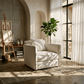 Yolanda Beige Chenille Chair w/Pillow in a cozy and inviting interior setting with natural light.