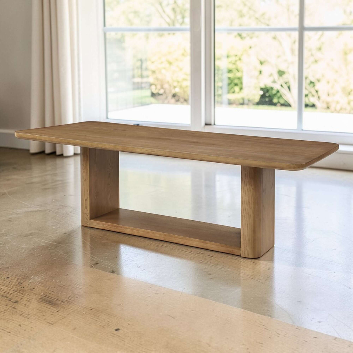 Zoey Contemporary Oak Wood Dining Table 95" in a stylish living space with natural light and modern decor.