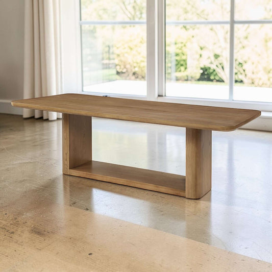 Zoey Contemporary Oak Wood Dining Table 95" in a stylish living space with natural light and modern decor.