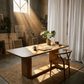 Zoey Contemporary Oak Wood Dining Table 95" in a sunlit modern dining space with plants and warm decor.