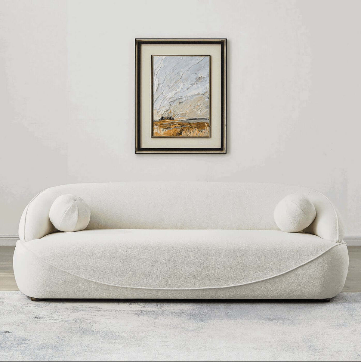 Modern Curved Boucle Sofa 84” (3 Colors) – Andrew Minimalist Sculptural Couch in a stylish living room setting.
