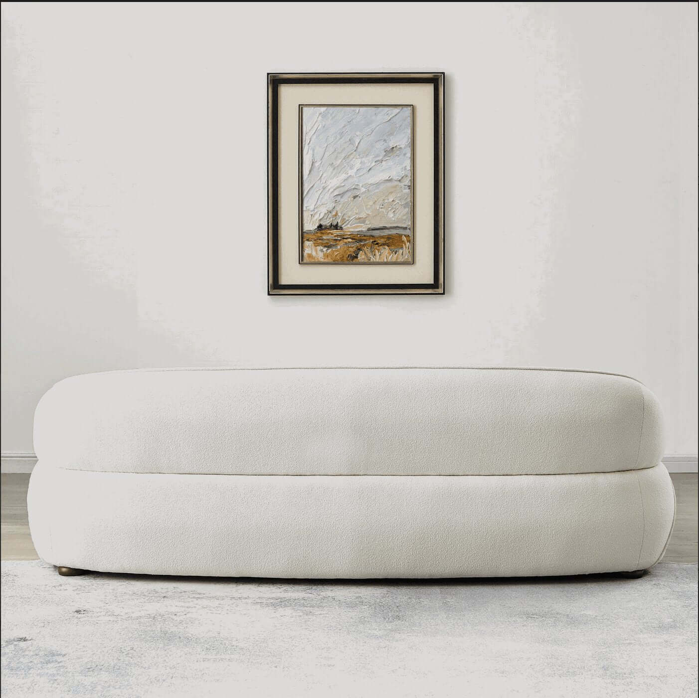 Modern Curved Boucle Sofa 84” (3 Colors) – Andrew Minimalist Sculptural Couch paired with wall art.