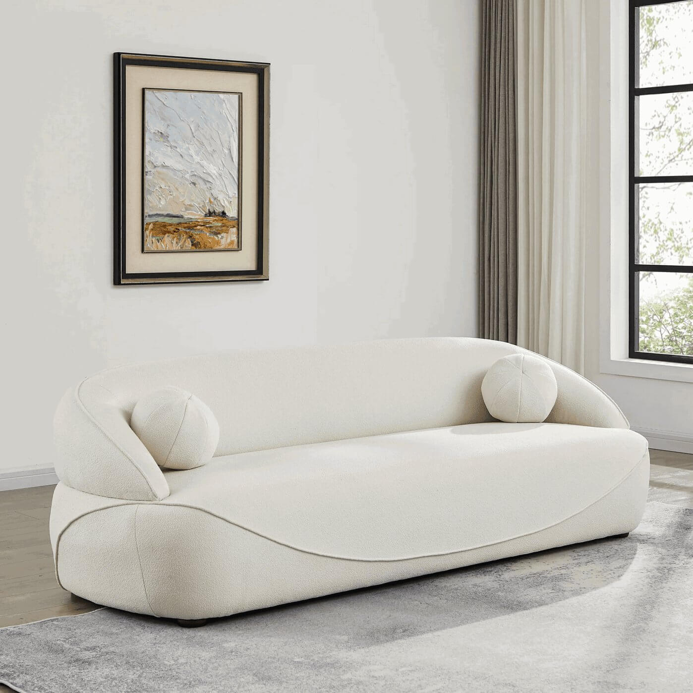 Modern Curved Boucle Sofa 84” (3 Colors) – Andrew Minimalist Sculptural Couch in a stylish living room setting.