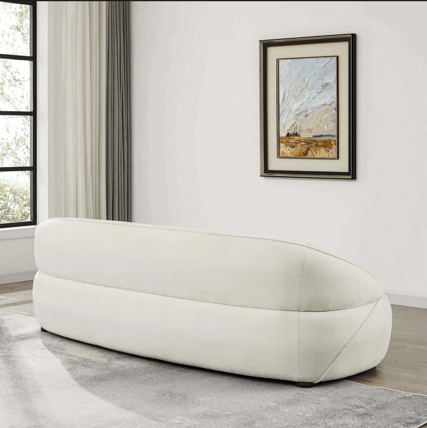 Modern Curved Boucle Sofa 84” (3 Colors) – Andrew Minimalist Sculptural Couch in a minimalist living room setting.